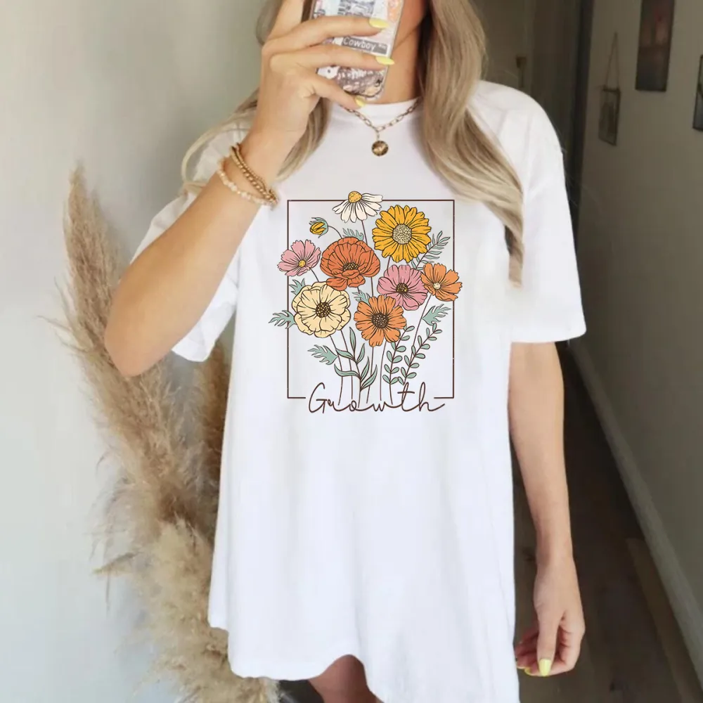 A Floral Design With Flowers In Various Colors Such As Yellow, Orange, Pink, And Branches Surrounding The Flowers. 