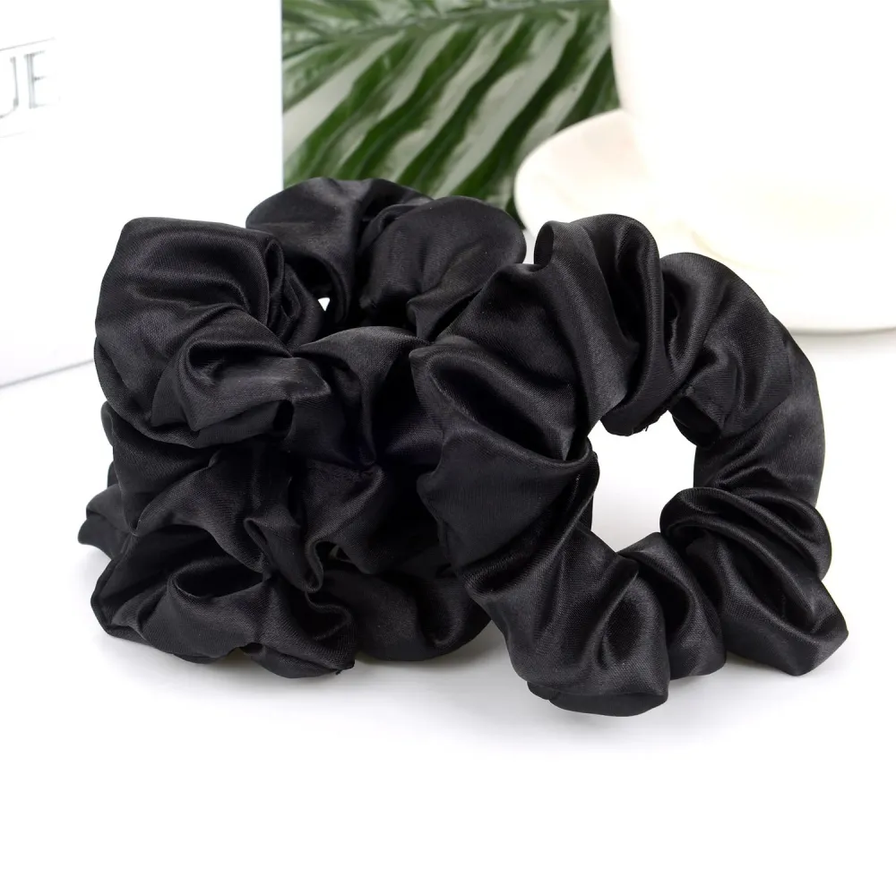 A Pack Of Ten Black Satin Elastic Hair Bands