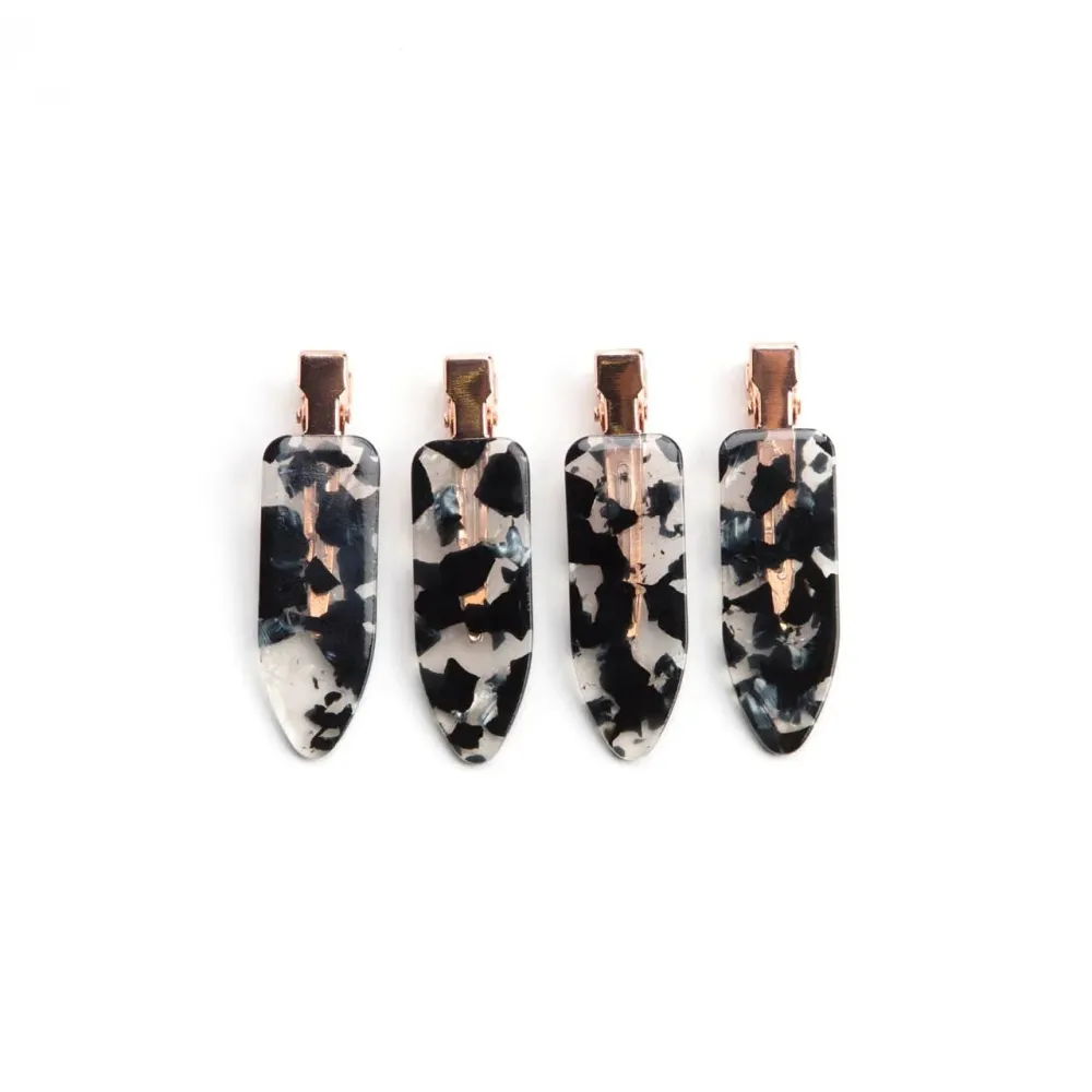 A Set Of Four Universal Black And White Striped Hair Clips For Fashion Use